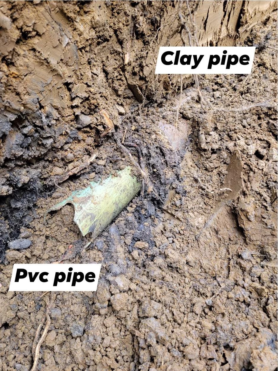 Trench wall showing clay and PVC junction in Hamburg excavation